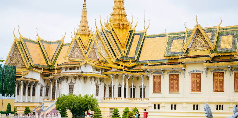 Stunning view of the Royal Palace in Phnom Penh, Cambodia with intricate golden spires.