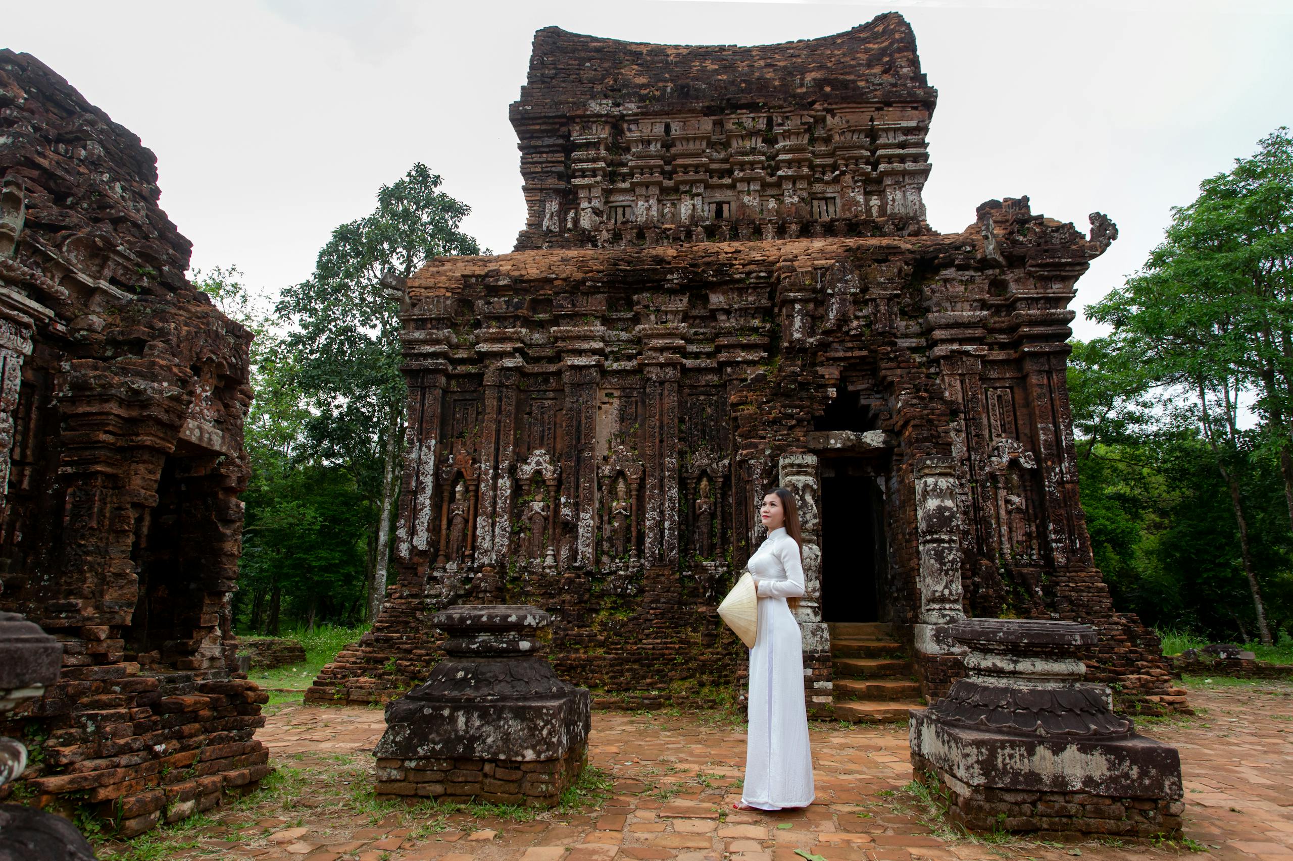 Woman in traditional Vietnamese dress at My Son Sanctuary, Quang Nam.